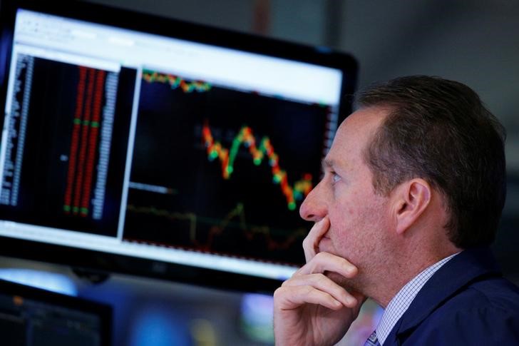 © Reuters. A specialist trader works at his post on the floor  of the NYSE in New York