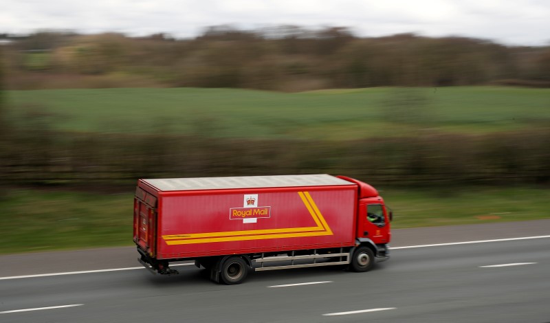 © Reuters. FILE PHOTO: A Royal Mail vehicle drives along the M6 motorway near Knutsford, northern England.
