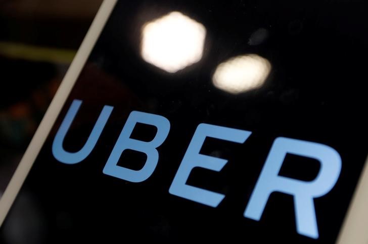 © Reuters. The logo of Uber is seen on an iPad, during a news conference to announce Uber resumes ride-hailing service, in Taipei