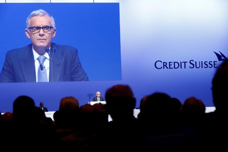 © Reuters. CEO Tidjane Thiam sites beside Chairman Urs Rohner of Swiss bank Credit Suisse as he addresses the audience at the bank's extraordinary shareholder meeting in Zurich