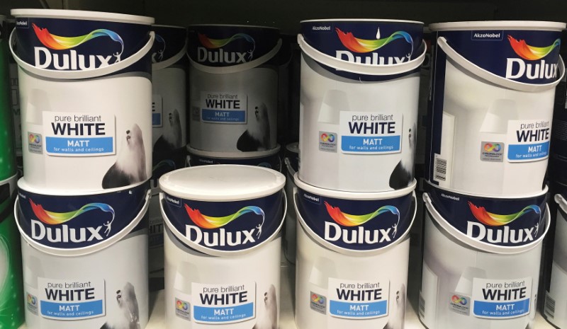 © Reuters. Cans of Dulux paint , an Akzo Nobel brand, are seen on the shelves of a hardware store near Manchester, Britain.