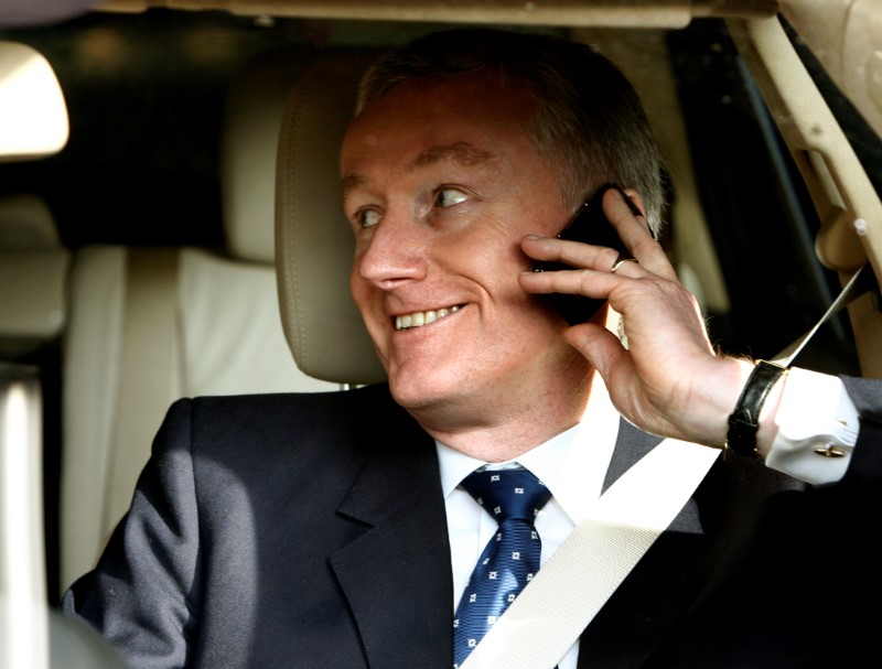 © Reuters. FILE PHOTO: Royal Bank of Scotland Chief Exectutive Fred Goodwin smiles as he leaves the Edinburgh International Conference Centre in Edinburgh