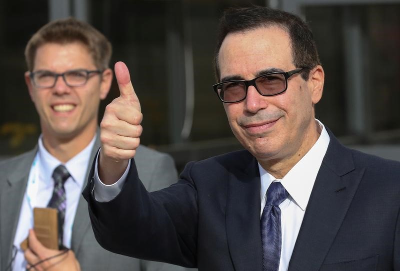 © Reuters. U.S. Secretary of the Treasury Steven Mnuchin gestures as he walks during a G7 for Financial ministers in the southern Italian city of Bari