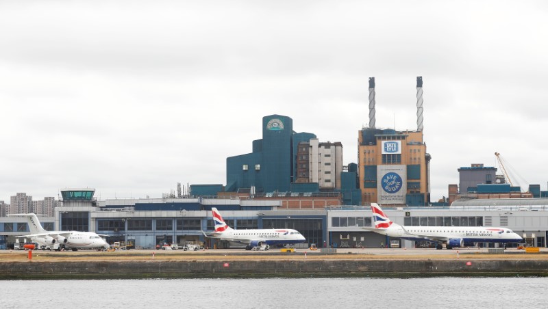 © Reuters. FILE PHOTO: Aircraft stand idle at City Airport after a protest closed the runway causing flights to be delayed, in London