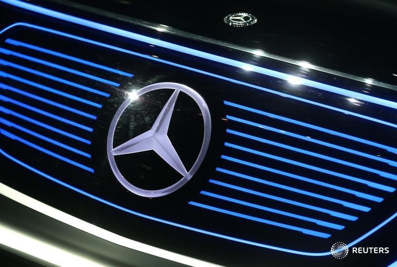 © Reuters. A Mercedes sign is seen on the car before the Daimler annual shareholder meeting in Berlin