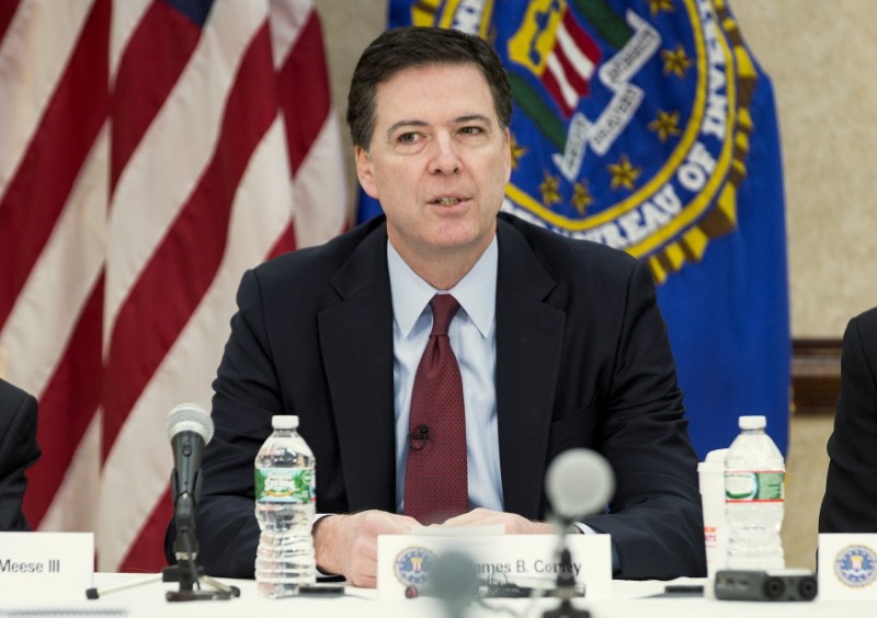 © Reuters. File photo:  Comey speaks during a news conference on the release of the 9/11 Review Commission report in Washington
