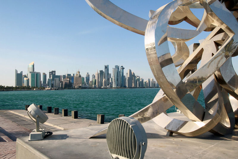 © Reuters. FILE PHOTO: Buildings are seen from across the water in Doha