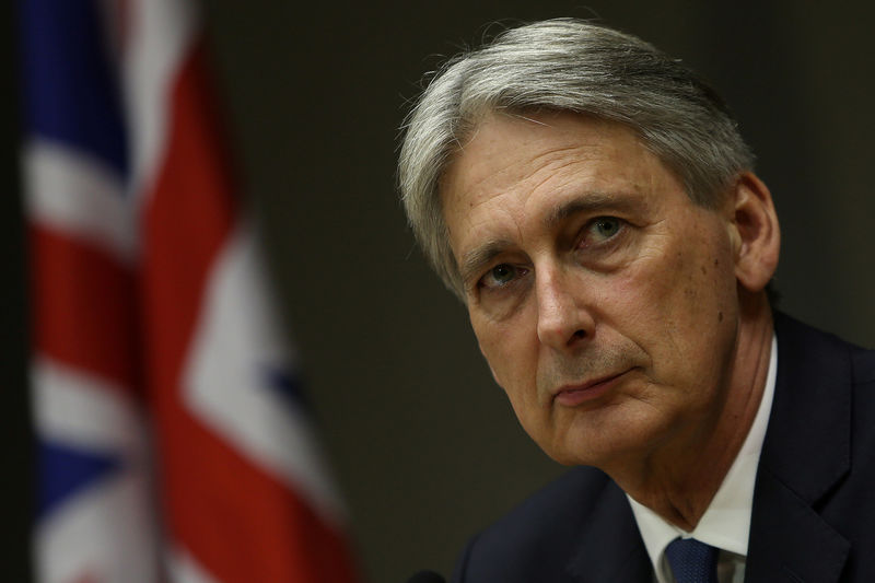 © Reuters. FILE PHOTO - Britain's Chancellor of the Exchequer Hammond attends a meeting in Brasilia