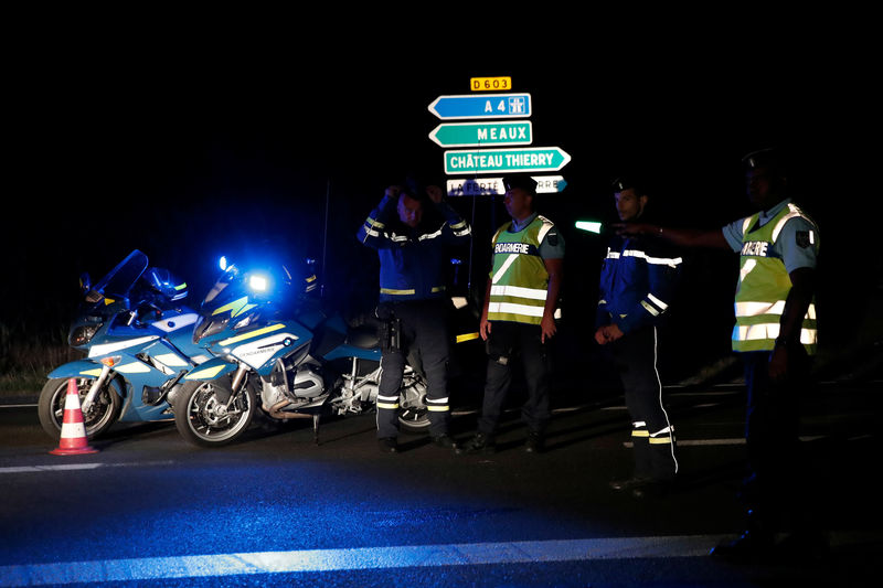 © Reuters. French gendarmes maintain a roadblock a certain distance from the scene where a car ploughed into the outdoor terrace of a pizzeria in Sept-Sorts