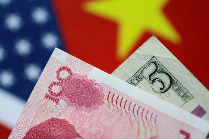 © Reuters. FILE PHOTO: Illustration photo of U.S. Dollar and China Yuan notes