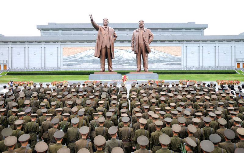 © Reuters. Servicepersons of the Korean People's Army (KPA) and the Korean People's Internal Security Forces (KPISF), civilians, school youth and children visited the statues of President Kim Il Sung and leader Kim Jong Il