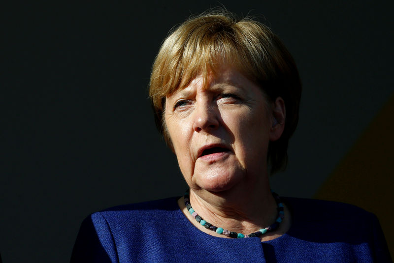 © Reuters. German Chancellor Merkel, top candidate of the Christian Democratic Union Party (CDU), attends an election rally for the upcoming federal elections in Gelnhausen near Frankfurt