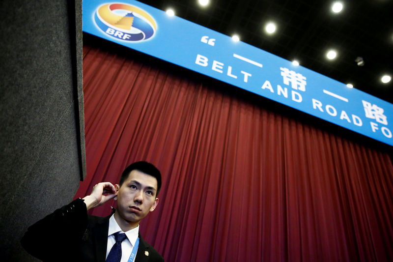 © Reuters. FILE PHOTO - A security guard stands at the entrance to the opening ceremony of the Belt and Road Forum in Beijing
