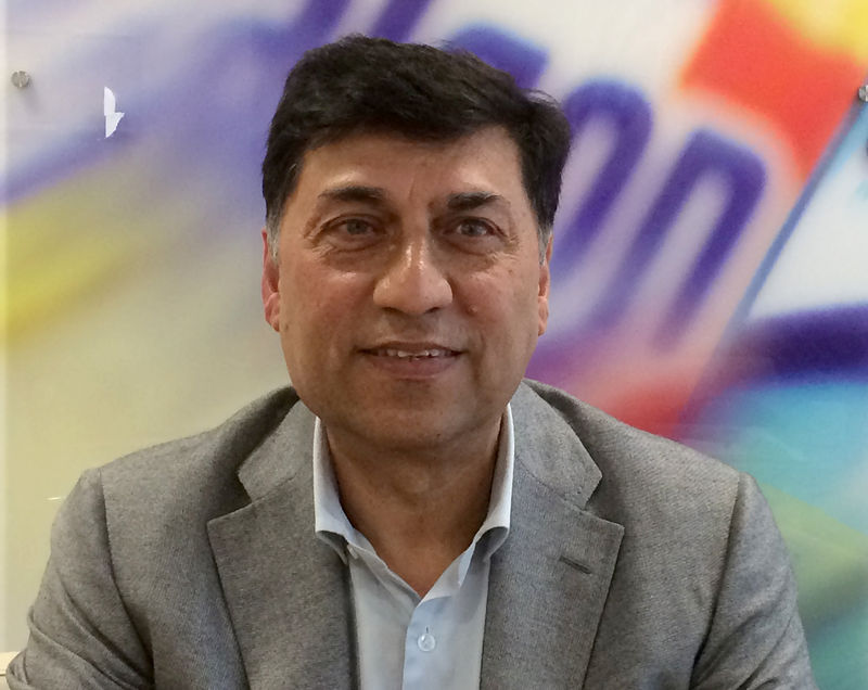 © Reuters. Rakesh Kapoor, the CEO of Reckitt Benckiser, poses for a photograph at the company headquarters in Slough