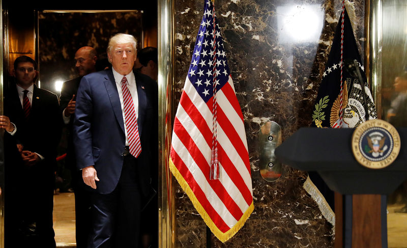 © Reuters. President Trump arrives to speak to press in the lobby of Trump Tower in New York