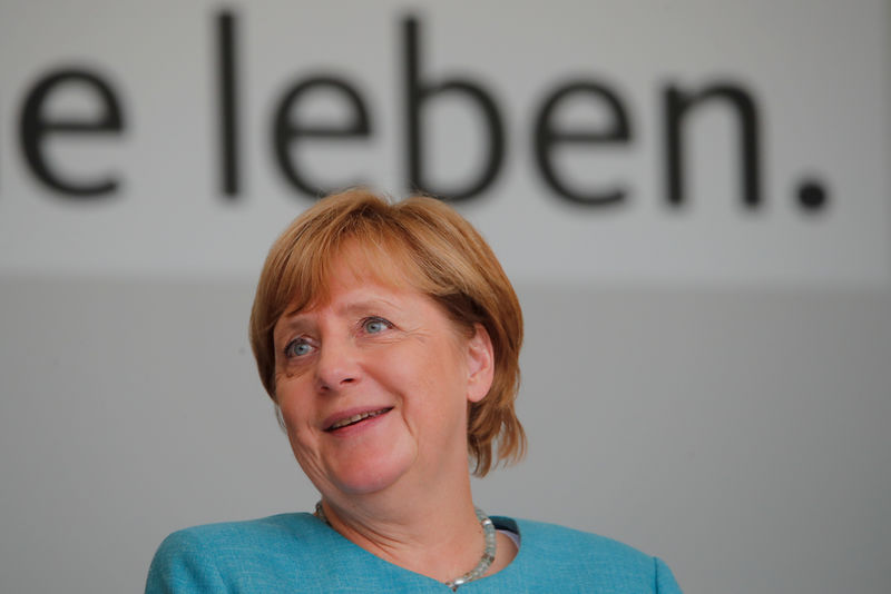 © Reuters. German Chancellor Angela Merkel reacts at a CDU campaign rally ahead of the upcoming federal election, in Koblenz