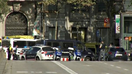 © Reuters. A still image from video shows a police cordon on a street in Barcelona, Spain following a van crash