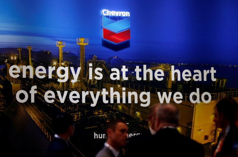 © Reuters. FILE PHOTO: The logo of Chevron Corp is seen in its booth at Gastech, the world's biggest expo for the gas industry, in Chiba