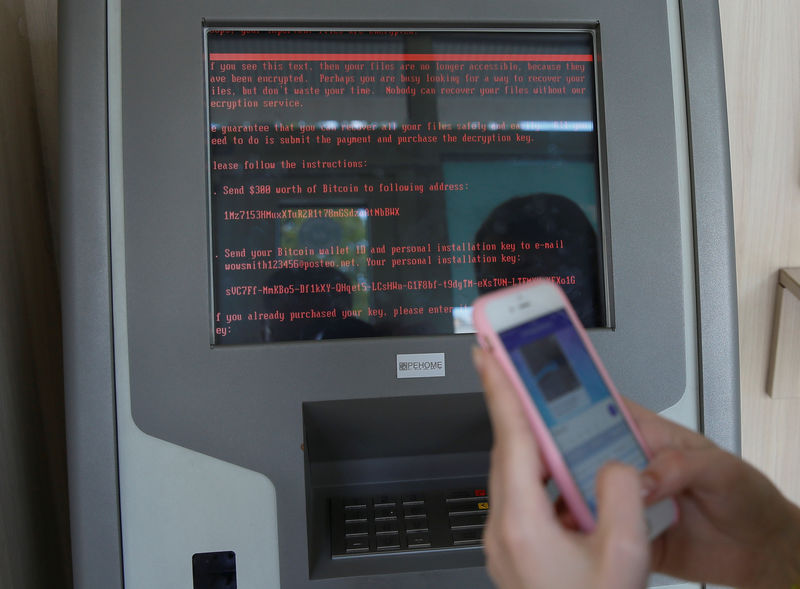 © Reuters. FILE  PHOTO: A message demanding money is seen on a monitor of a payment terminal at a branch of Ukraine's state-owned bank Oschadbank after Ukrainian institutions were hit by a wave of cyber attacks earlier in the day, in Kiev