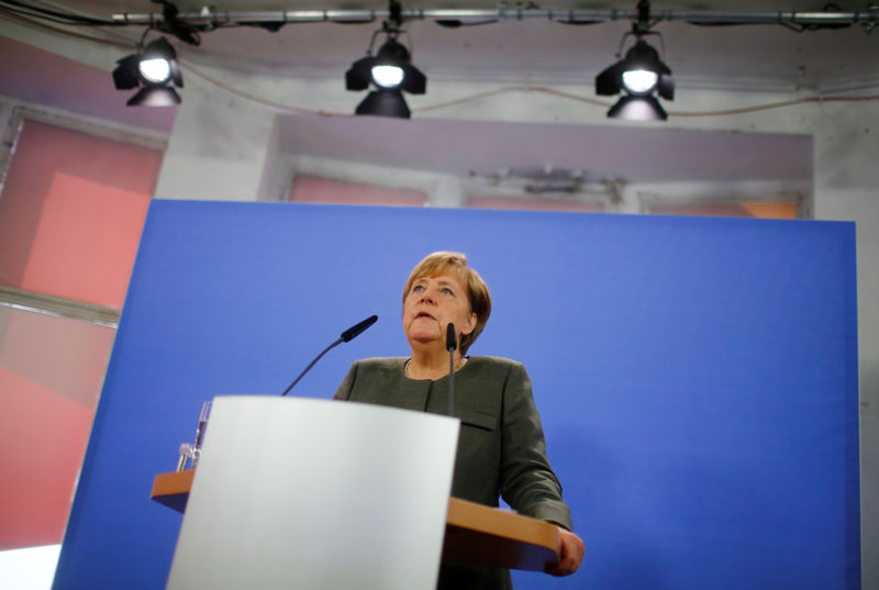 © Reuters. German Chancellor Merkel addresses the media in Berlin