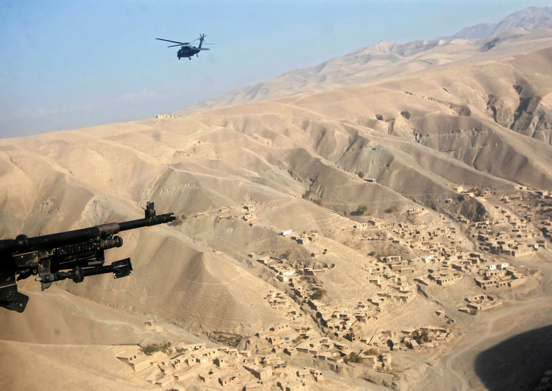 © Reuters. FILE PHOTO: U.S. helicopter flies near the new-found gold mine site in Nor Aaba in Takhar province