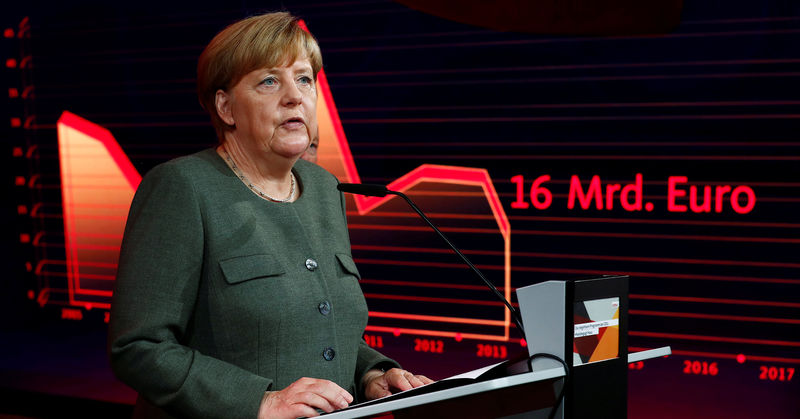 © Reuters. German Chancellor Merkel, top candidate of the Christian Democratic Union Party (CDU), presents the new interactive election campaign ahead of the upcoming federal election in Berlin