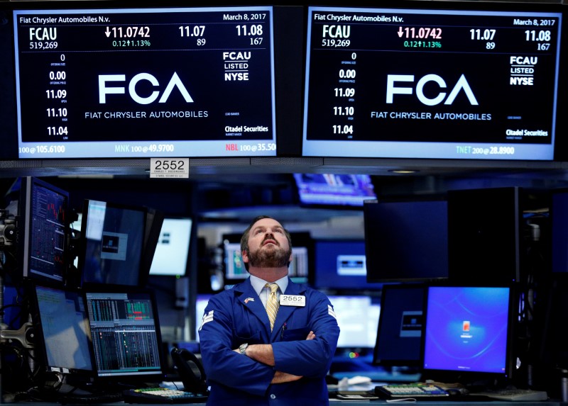 © Reuters. A specialist trader works at the post where Fiat Chrysler Automobiles is traded on the floorof the NYSE