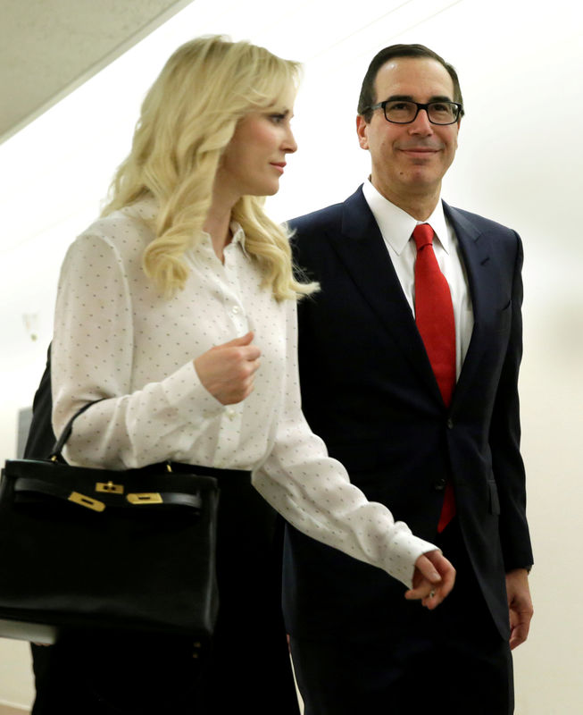 © Reuters. FILE PHOTO: U.S. Treasury Secretary Mnuchin arrives with his fiance Linton at hearing on Capitol Hill in Washington