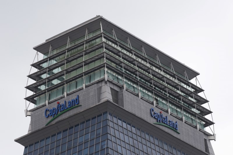 © Reuters. CapitaLand Ltd signages are pictured at one of their properties in Singapore