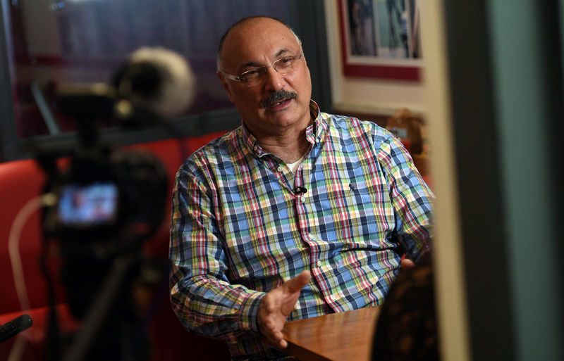 © Reuters. Cafe Diana owner Abdul Daoud speaks to a Reuters journalist during an interview inside the Cafe Diana in London