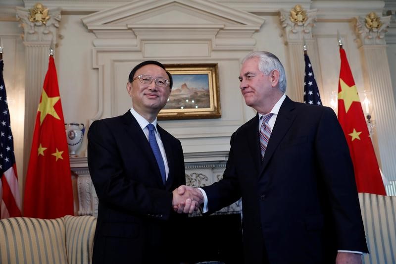 © Reuters. Secretary of State Rex Tillerson greets Chinese State Councilor Yang Jiechi at the State Department in Washington