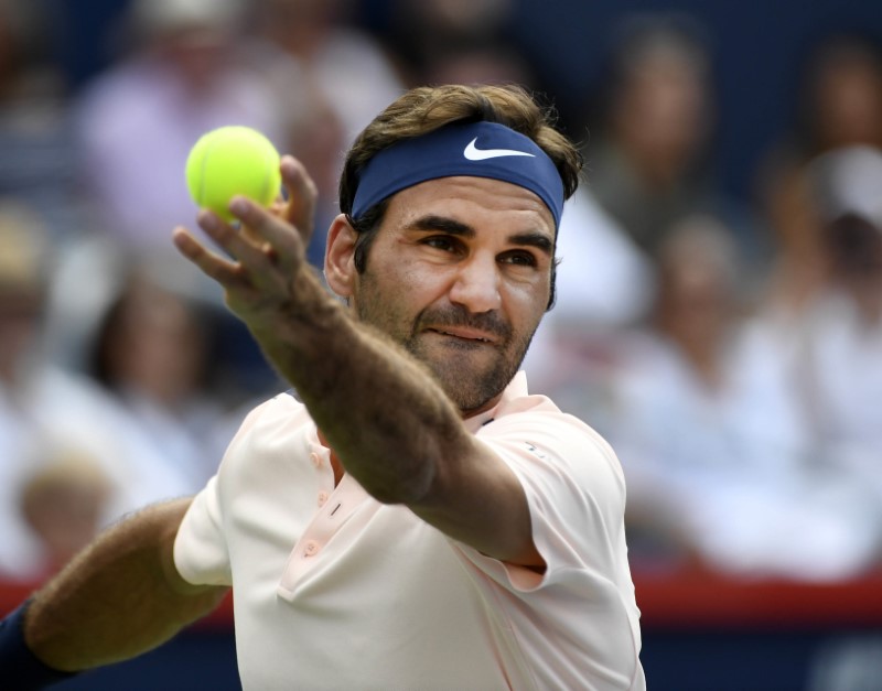 © Reuters. McEnroe prevé que Federer tendrá un Abierto de EEUU mágico