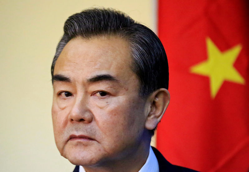 © Reuters. FILE PHOTO - China's Foreign Minister Wang listens during a news conference with Sudan's Foreign Minister Karti in Khartoum