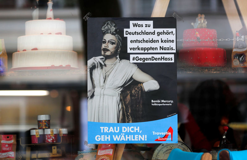 © Reuters. A poster of a fictional party called Travestie for Germany (TfD) as a parody of the anti-Immigrant Alternative for Germany (AfD) party is pictured in Berlin