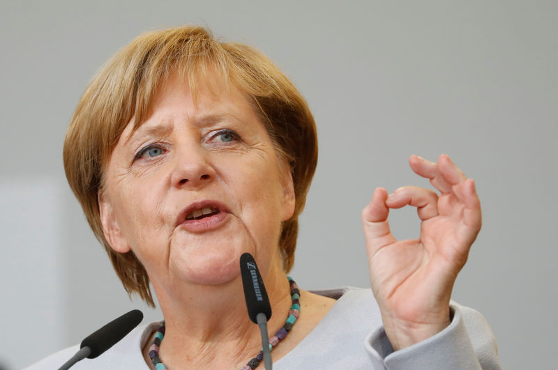 © Reuters. German Chancellor Angela Merkel, a top candidate of the Christian Democratic Union Party (CDU), gives a speech during an election rally in Vacha