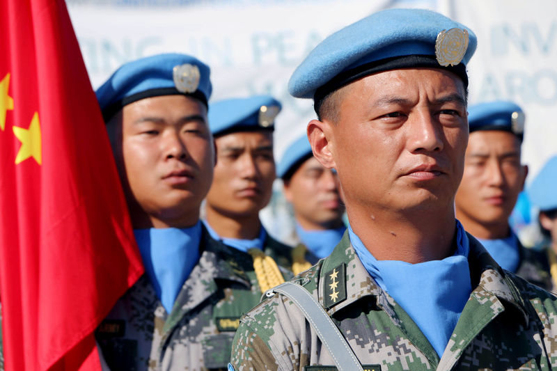 © Reuters. Chinese Peacekeepers in the United Nations Mission to South Sudan parade during the International Day of United Nations Peacekeepers in Juba