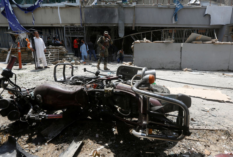 © Reuters. An Afghan security force stands guard at the site of a suicide bomb attack in Kabul