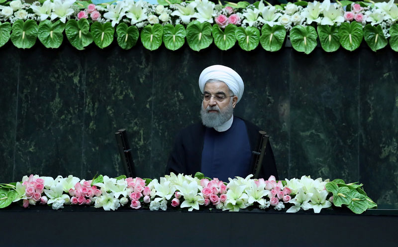 © Reuters. Iranian president Hassan Rouhani attends his swearing-in ceremony for a further term, at the parliament in Tehran