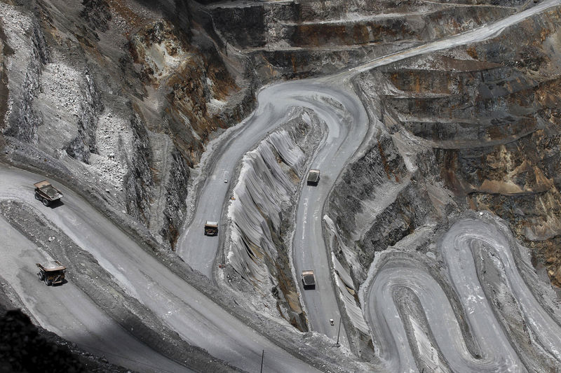 © Reuters. FILE PHOTO: Trucks operate in the open-pit mine of PT Freeport's Grasberg copper and gold mine complex near Timika