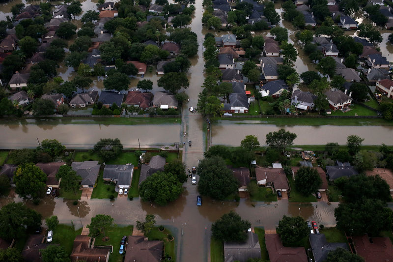 © Reuters. Houses are seen partially submerged in flood waters caused by Tropical Storm Harvey in Northwest Houston