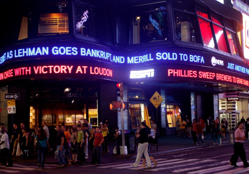 © Reuters. FILE PHOTO - Lehman Brothers name moves across a news ticker in New York's Times Square