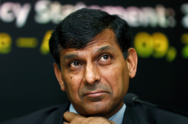 © Reuters. Rajan listens to questions during a news conference at the RBI headquarters in Mumbai