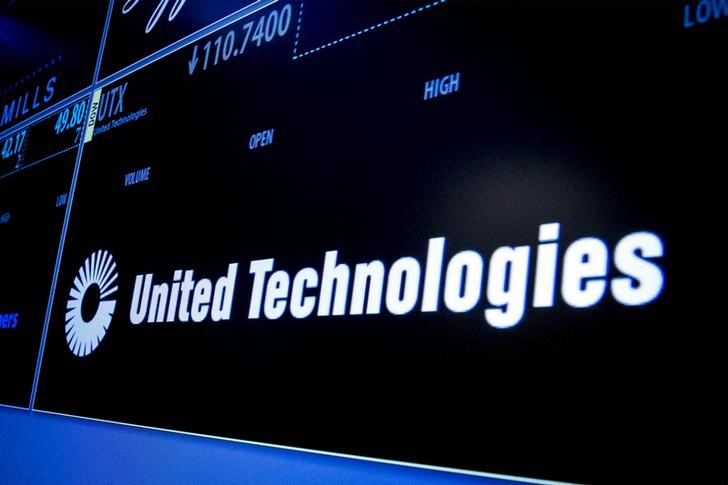 © Reuters. FILE PHOTO - Ticker symbol for United Technologies is displayed on a screen on the floor of the New York Stock Exchange