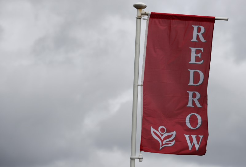 © Reuters. The company logo of construction company Redrow is pictured on a flag at a new housing development near Manchester northern England.