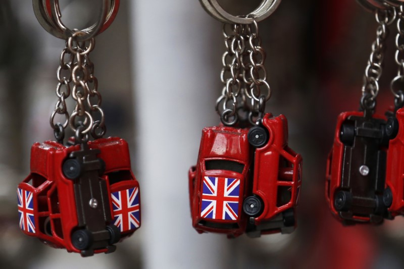 © Reuters. Union flags are painted onto car shaped keyrings for sale in London, Britain