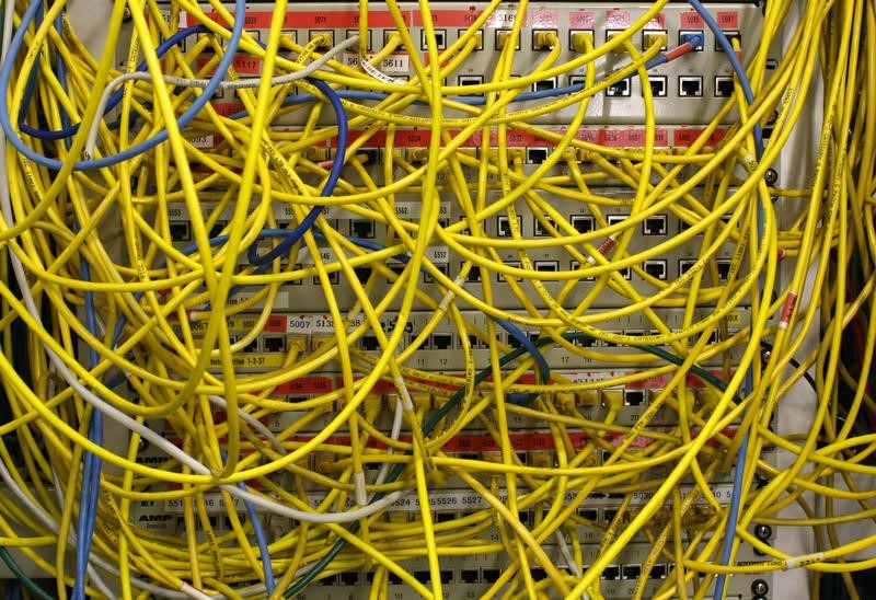 © Reuters. Ethernet cables used for internet connections are pictured in a Berlin office