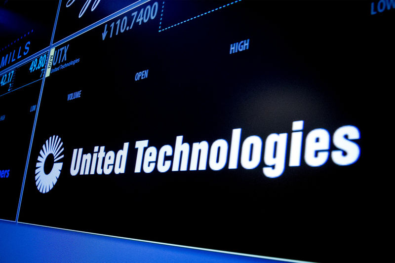 © Reuters. FILE PHOTO: Ticker symbol for United Technologies is displayed on a screen on the floor of the New York Stock Exchange