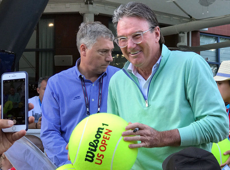 © Reuters. Tennis legend Connors collects donations for Hurricane Harvey relief efforts at the U.S. Open in New York