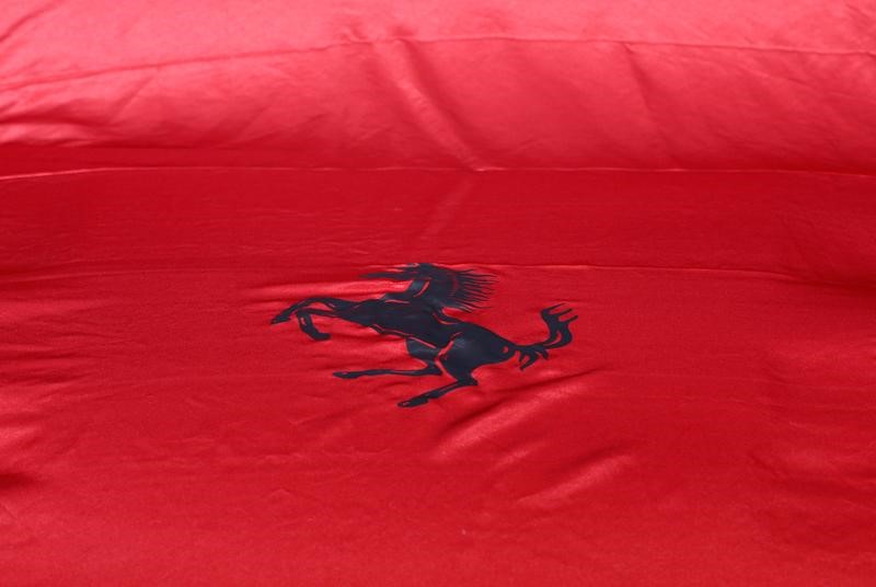 © Reuters. A Ferrari logo is pictured on a covered car during the 87th International Motor Show at Palexpo in Geneva
