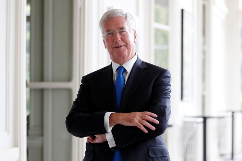 © Reuters. British Defence Secretary Michael Fallon poses after an interview with Reuters at the British Embassy in Paris